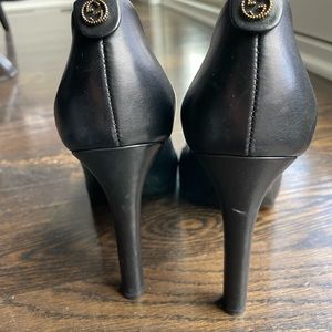 Black Gucci heels.